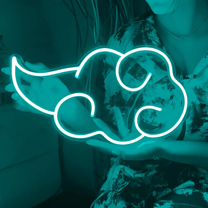 Akatsuki Cloud Neon Sign - A girl holding a teal colored cloud shaped neon sign - from manhattonneons.com