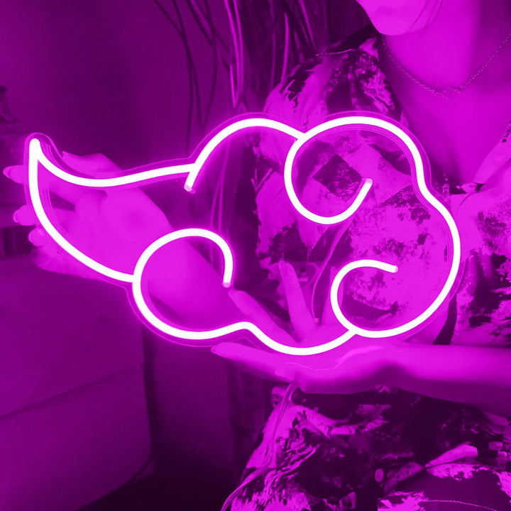 Akatsuki Cloud Neon Sign - A girl holding a pink colored cloud shaped neon sign. - from manhattonneons.com