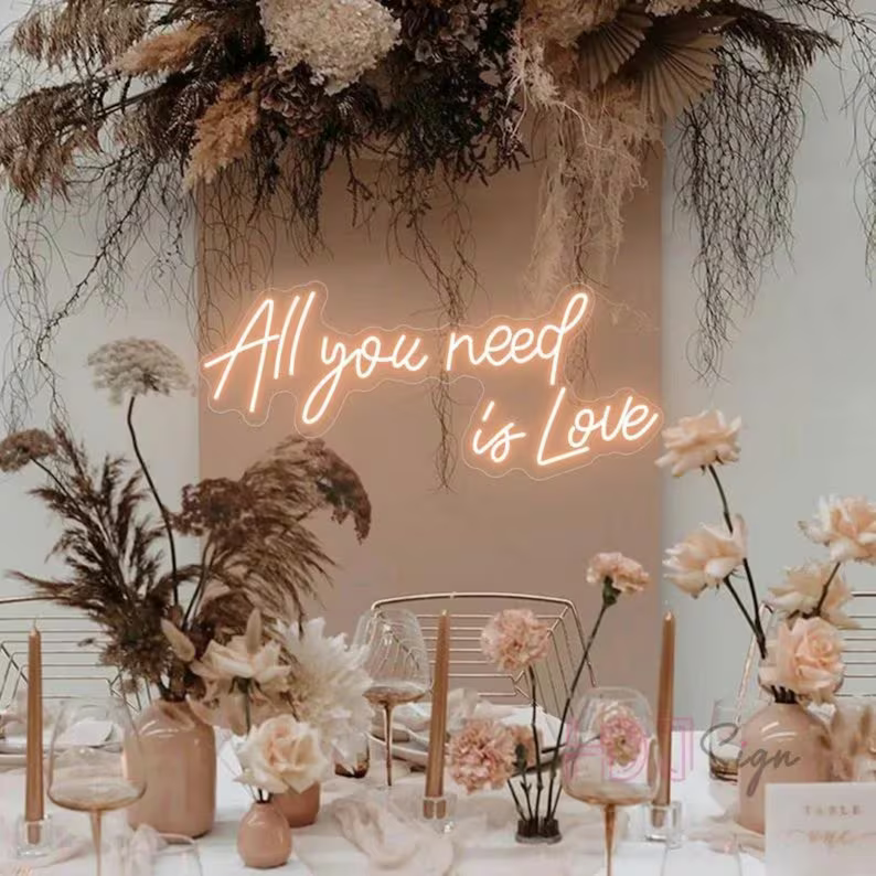 Surround yourself with love and flowers with the All You Need Is Love wedding neon sign from ManhattanNeons.com