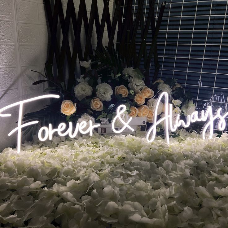 Capture your love story with the It Was Always You wedding neon sign from ManhattanNeons.com, nestled among blooming flowers in our round display.