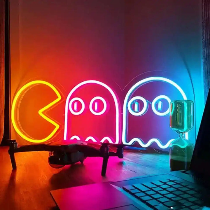 Pac-Man Chasing Ghosts Neon Sign | Bring Retro Gaming Fun to Life - Illuminated Arcade Nostalgia from manhattonneons.com