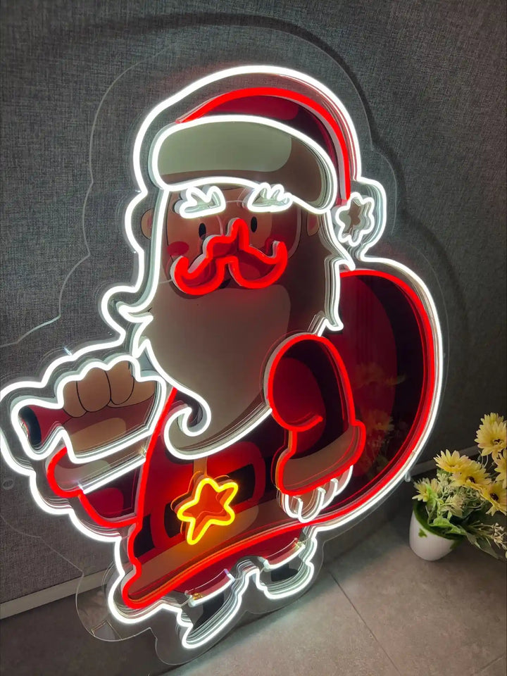 it's a UV sign with santa claus in it where it shows a neon sign as well with white and red combination  - from manhattonneons.com.