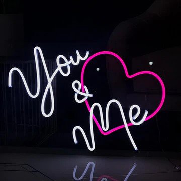 the You and Me heart wedding neon sign from ManhattanNeons.com looks stunning with its pink heart.