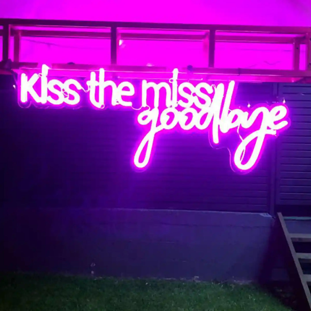 Kiss the Miss Goodbye Wedding Neon Sign - A playful and charming neon sign, perfect for celebrating the bride-to-be's last fling before the ring - from manhattonneons.com