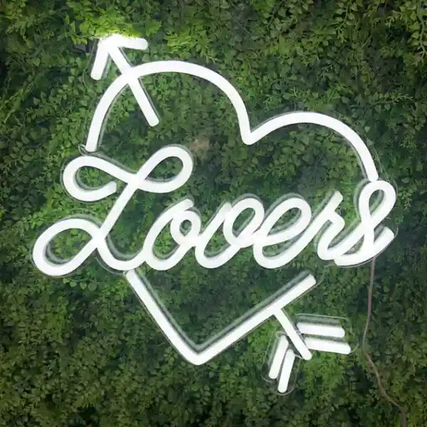 Lovers Heart Wedding Neon Sign shines romantically amidst the darkness - from manhattonneons.com 