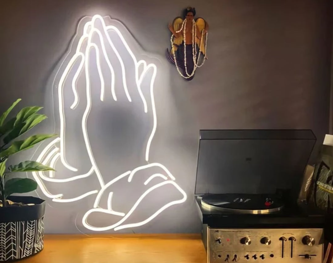 Praying Hands Easter Neon Sign by manhattanneons.com – A glowing tribute to faith and Easter celebrations.